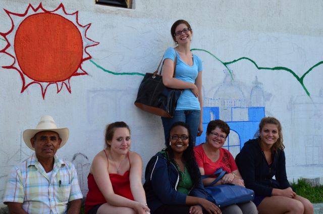 students and mural in Oaxaca