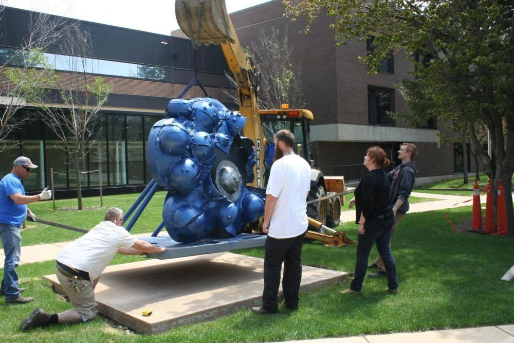 Installation of “Thunder Cloud,” a cast iron sculpture by Coral Lambert.