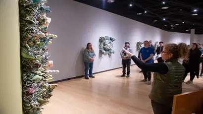 Fredonia students and faculty gather for an art gallery reception