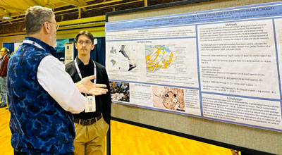 Shaun Sanders, with his poster presentation.