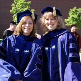 Two Faculty Members in Blue Regalia