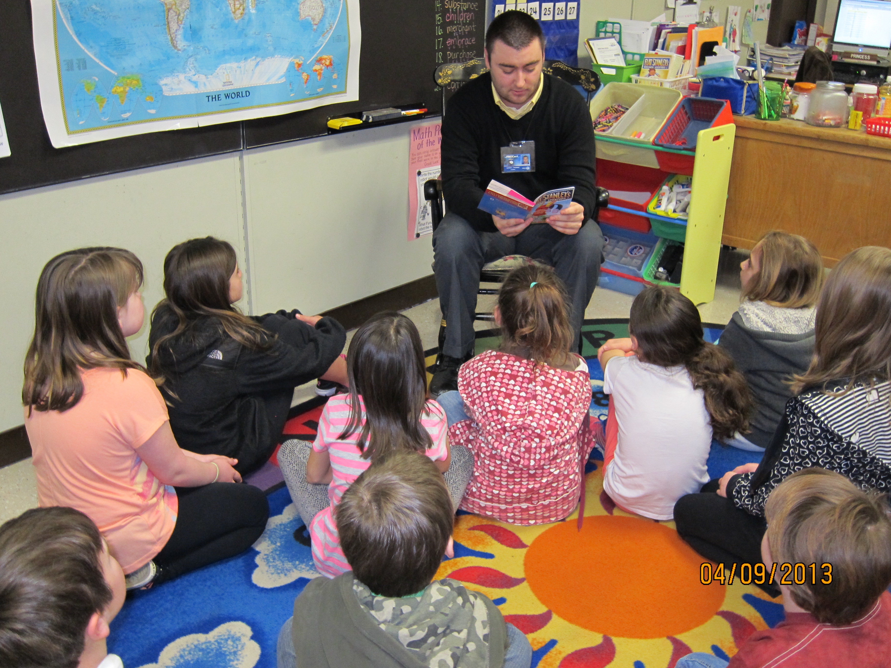 Teacher candidate reading to students