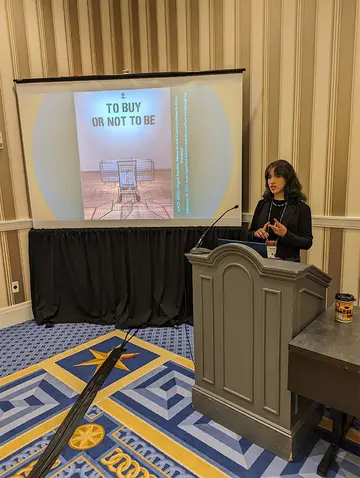 Hannah Barden delivers her presentation at the National Communication Association’s annual conference in National Harbor, MD.