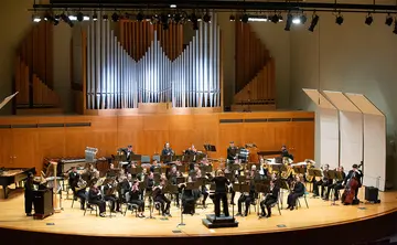 the wind ensemble performing in King Concert Hall