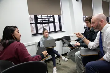 Fredonia students engaging with a professor in an accounting class